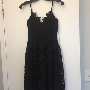 Black lace knee length strappy dress